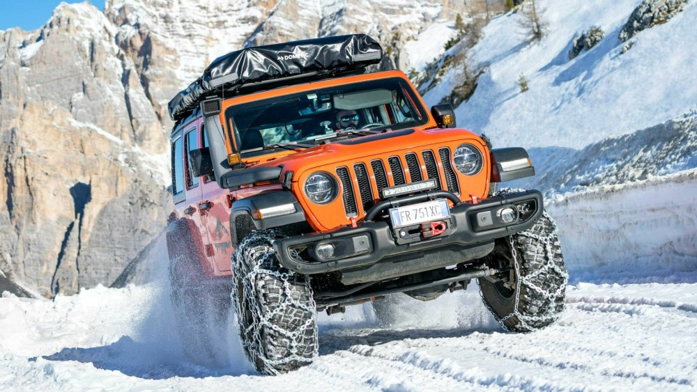 Snow chains fitted to JEEP